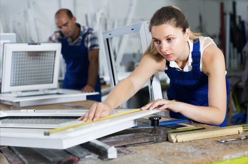 woman fabricating custom polycarbonate or acrylic windshields out of polycarbonate or acrylic